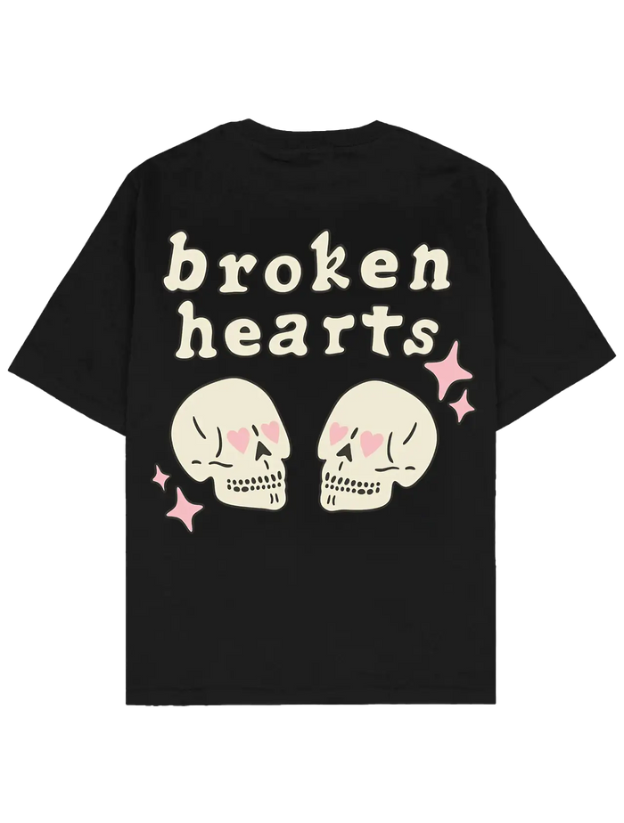 #siyah oversize boxy fit Southline tişört; arka baskıda “broken hearts” yazısı, kalp gözlü iki kafatası illüstrasyonu ve pembe yıldız detayları bulunan 280 GSM heavy-weight pamuk streetwear t-shirt.
